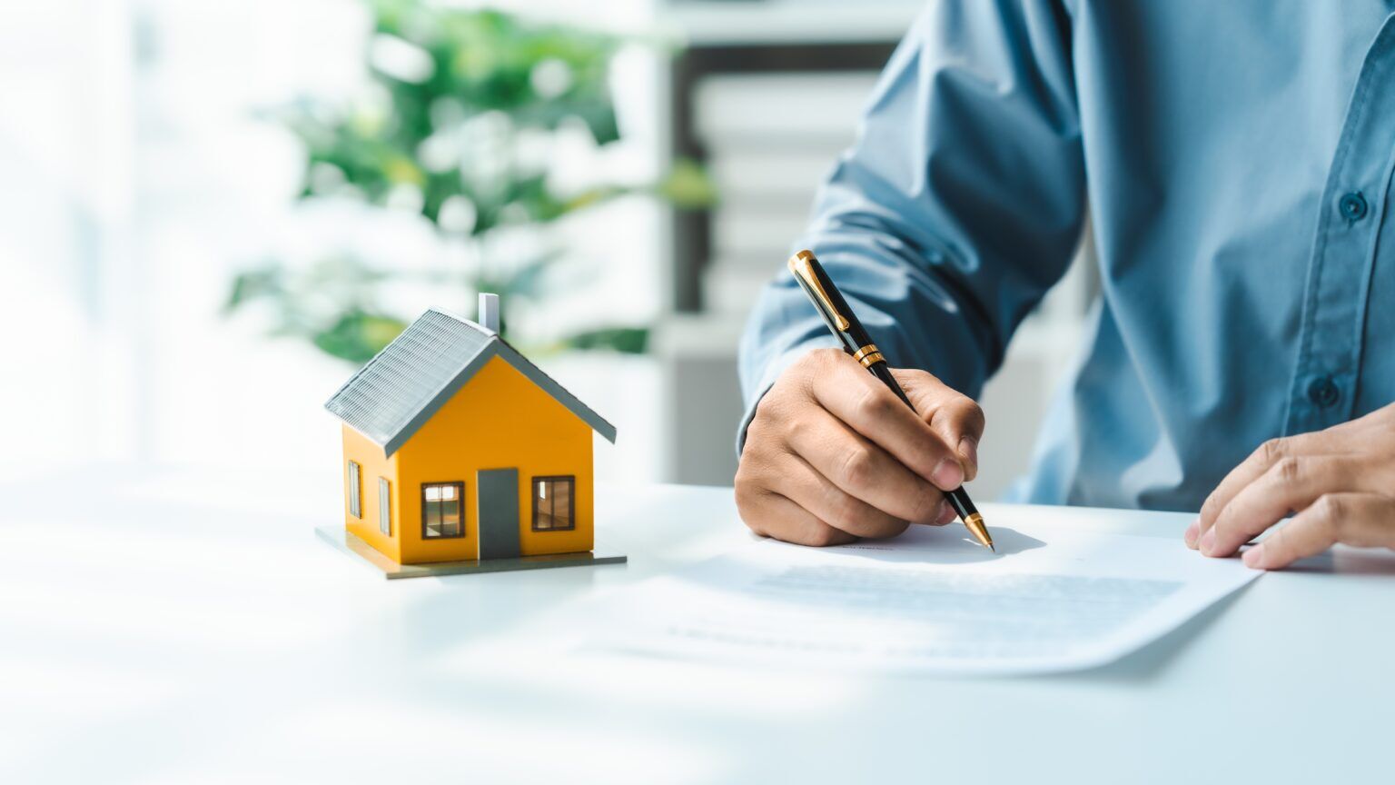 Gold Coast mortgage broker reviewing home loan paperwork with a client