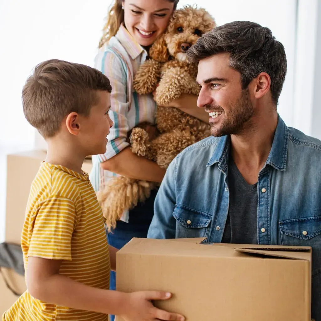 Happy family with their dog moving into a new home